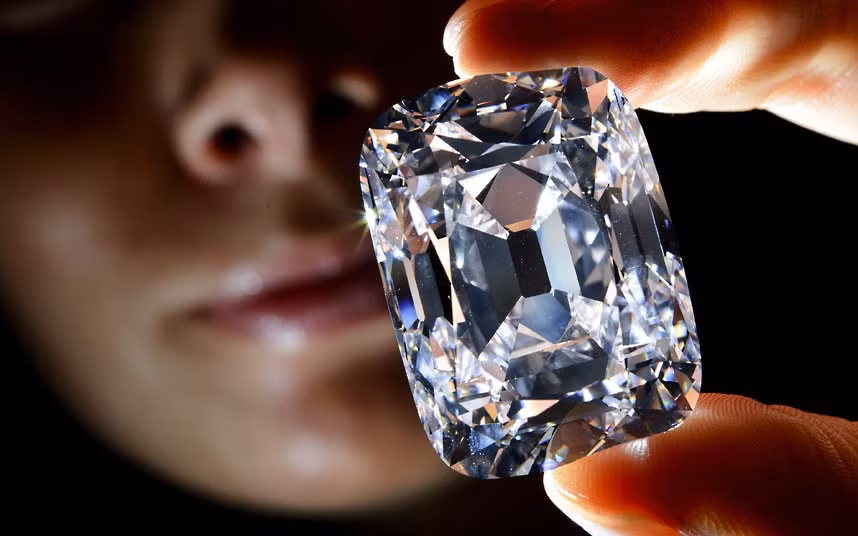 A model holds the Archduke Joseph diamond during a Christie’s auction preview in Geneva. Once part of the collection of the Archduke Joseph of Austria (1872-1962), the diamond, weighing 76,02 carats and mined at the legendary Indian Golkonda mine, is expected to reach between 9.3 million and 12.4 million pounds at an auction on November 13 in Geneva.