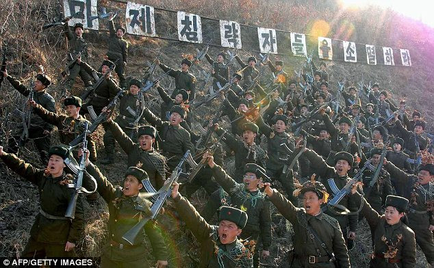 Warlike: North Korean members of the Worker-Peasant Red Guards shouting anti-U.S. slogans Read more: http://www.dailymail.co.uk/news/article-2293200/North-Korea-uses-live-artillery-drills-near-border-Kim-Jong-Un-continues-threats.html#ixzz2NWZuhaaS Follow us: @MailOnline on Twitter | DailyMail on Facebook