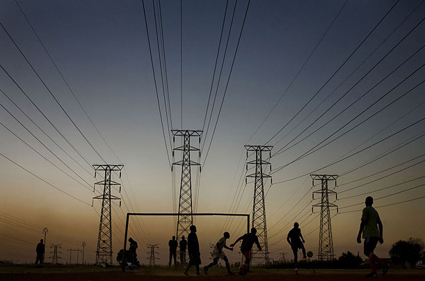 World Cup in South Africa Photographed by Dominic Nahr / Reportage / Getty Images for TIME A group of boys play soccer beneath power lines near the newly built Soccer City Stadium in Johannesburg Read more: http://www.time.com/time/photogallery/0,29307,2036245,00.html#ixzz18Zkl0dHY