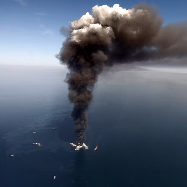 An aerial photo shows oil in the Gulf of Mexico, as the Deepwater Horizon oil rig burns. The oil platform that burned for more than day after a massive explosion sank into the Gulf of Mexico, turning a deadly blast into a likely environmental emergency