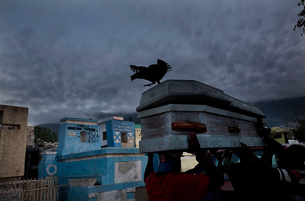 Funeral in Haiti Photographed by Shaul Schwarz / Reportage / Getty Images for TIME The Port-au-Prince cemetery had no more room, but the dead kept coming. Read more: http://www.time.com/time/photogallery/0,29307,2036245,00.html#ixzz18Zk5aQ58