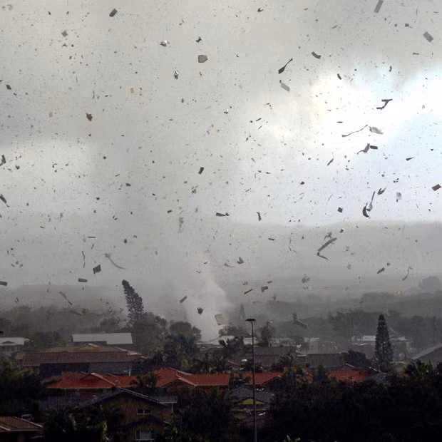 Debris flies through the air as a freak tornado tears through the coastal town of Lennox Head in New South Wales, Australia. The storm levelled 12 homes and damaged another 30, with twisting winds carving out a 300 metre-wide path of destruction, injuring six people and leaving thousands without power
