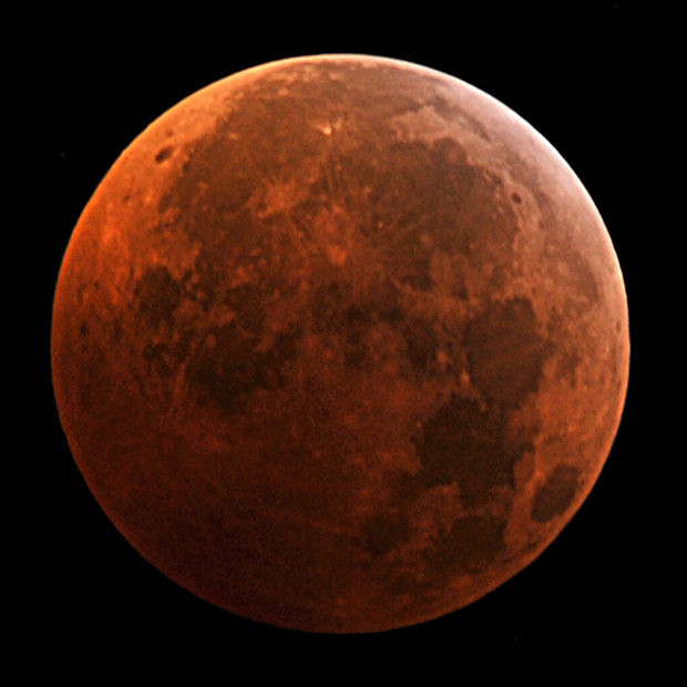 A picture taken in Manassas, Virginia, USA, shows the moon during the peak of the total eclipse 