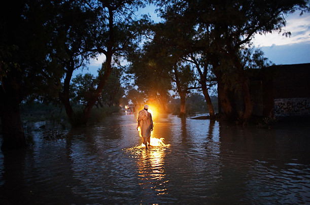 Floods in Pakistan Photographed by Daniel Berehulak / Getty Images A man walks through a flooded street in Nowshera. Floodwaters displaced tens of thousands of people in northwestern Pakistan. Read more: http://www.time.com/time/photogallery/0,29307,2036245,00.html#ixzz18ZmQQTfZ