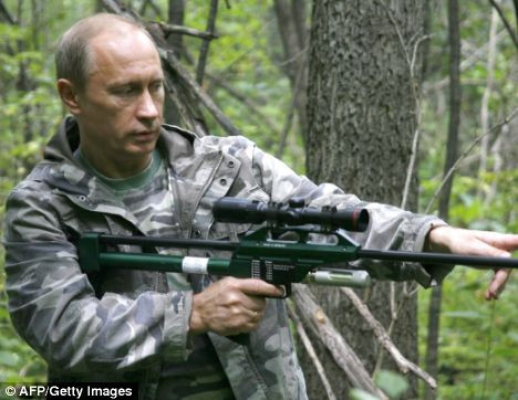 Putin holds a tranquiliser gun before shooting a ’runaway’ tiger back in 2008 Read more: http://www.dailymail.co.uk/news/worldnews/article-1255992/Action-man-Putin-King-wild-frontier-.html#ixzz0hRb7T8t1