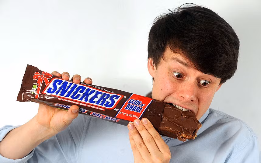 This giant Snickers is almost eight times the size of a standard bar. The huge chocolate contains 2,000 calories, which is equal to a woman