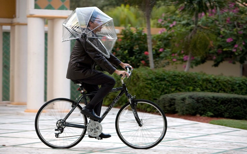 Những hình ảnh ấn tượng trong tuần ảnh 4 The new hands-free Nubrella umbrella resembles a bubble wrapped around the wearer’s head and shoulders and is designed to resist winds up to 50mph