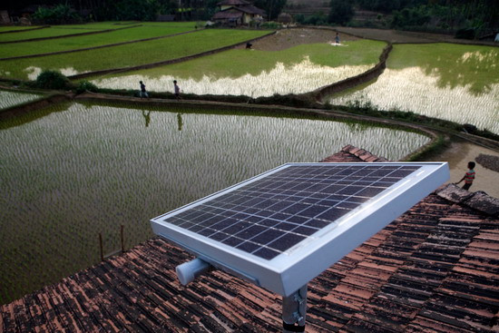 A solar panel stands on the roof of a house in Halliberu, India on January 11, 2012. Across India and Africa, startups and mobile phone companies are developing so-called microgrids, in which stand-alone generators power clusters of homes and businesses in places where electric utilities have never operated. 