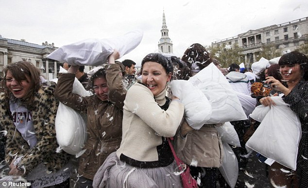 Pillow fighters swing wildly in Trafalgar Square, London Read more: http://www.dailymail.co.uk/news/article-2126610/All-war-115-cities-explode-flurry-feathers-International-Pillow-Fight-Day.html#ixzz1rPioymA1