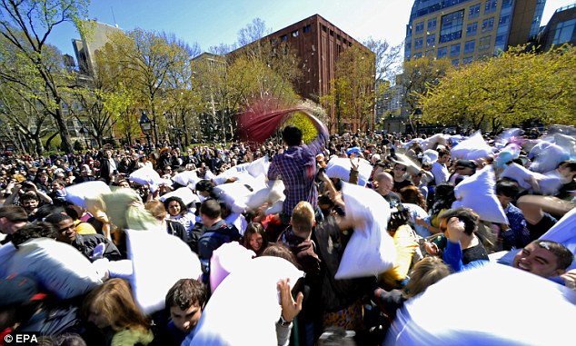 One fighter rises from the masses as thousands of people take part in Washington Square Park, NYC Read more: http://www.dailymail.co.uk/news/article-2126610/All-war-115-cities-explode-flurry-feathers-International-Pillow-Fight-Day.html#ixzz1rPj1hOIu