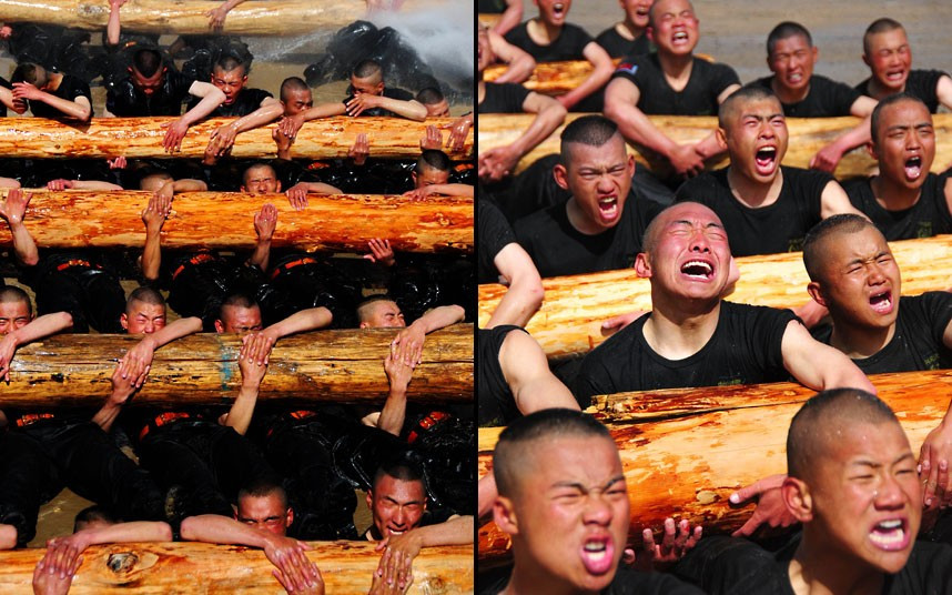 Police trainees take part in a drill with huge, heavy logs in Lhasa, Tibet Autonomous Region, China