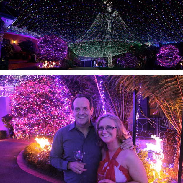 David and Janean Richards celebrate being awarded the Guinness World Record for the most Christmas lights on a residential property. Their home in Forrest Act, Australia, is illuminated by 331,038 Christmas lights. David Richards, a barrister and father of three, has worked on the decorations for over four years, with the number of lights having doubled from last year. David is reluctant to say how much the decorations cost, but all the money he receives from visitors goes to the charity SIDS and Kids, which he says helped his family out during a difficult period in 2002.