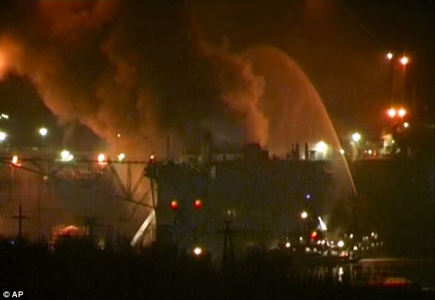 Smoke rises from the dock where the Yekaterinburg was being repaired today Read more: http://www.dailymail.co.uk/news/article-2079908/Blaze-breaks-Russian-nuclear-submarine-docked.html#ixzz1hz3D1gO6