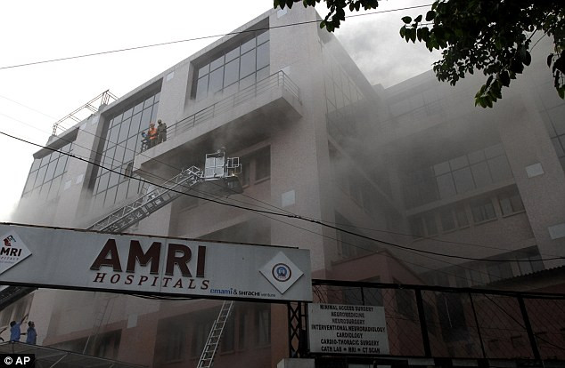 The blaze began in the basement of the AMRI Hospital private nursing home before quickly spreading to the upper floors Read more: http://www.dailymail.co.uk/news/article-2071981/60-dead-blaze-tears-Indian-nursing-home.html#ixzz1g2zs9pgF