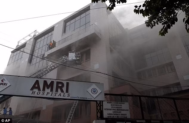 The blaze began in the basement of the AMRI Hospital private nursing home before quickly spreading to the upper floors Read more: http://www.dailymail.co.uk/news/article-2071981/60-dead-blaze-tears-Indian-nursing-home.html#ixzz1g2zs9pgF