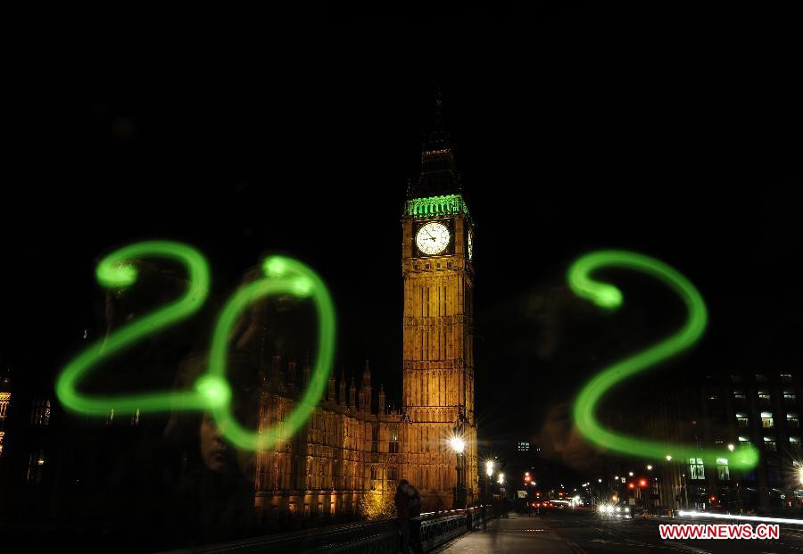 The light painting photo taken on Dec. 29, 2011 in front of the Parliament Buildings in London, Britain, shows the sign of 