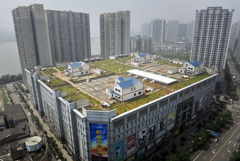 Những hình ảnh ấn tượng trong tuần ảnh 8 Villas are built on top of an eight-storey shopping centre in Zhuzhou, China