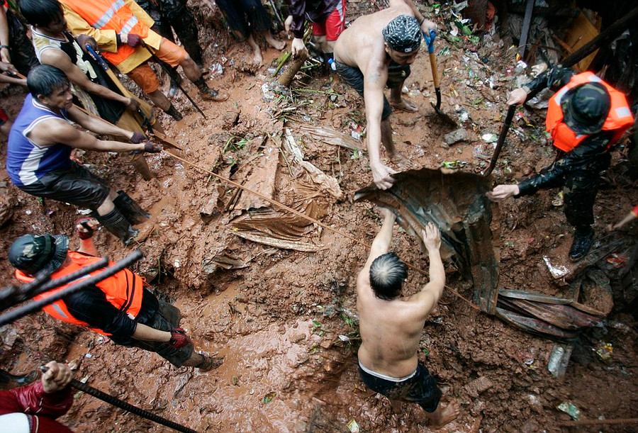 Desperate: Filipino rescuers dig for survivors after a landslide destroys four homes in Quezon City, north of the capital Manila Read more: http://www.dailymail.co.uk/news/article-2184925/Philippines-floods-Manila-submerged-leaving-9-dead-scores-homeless.html#ixzz22ujIjcJE