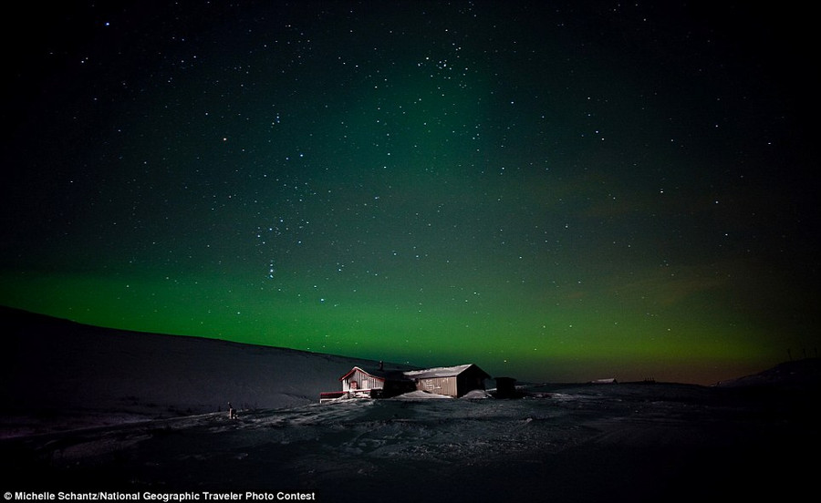 Michelle Schantz: A lonely cabin is illuminated under the Northern Lights in Finmmark, Norway Read more: http://www.dailymail.co.uk/news/article-2189479/National-Geographic-reveal-winners-2012-Photo-Contest.html#ixzz23mDVs4PA