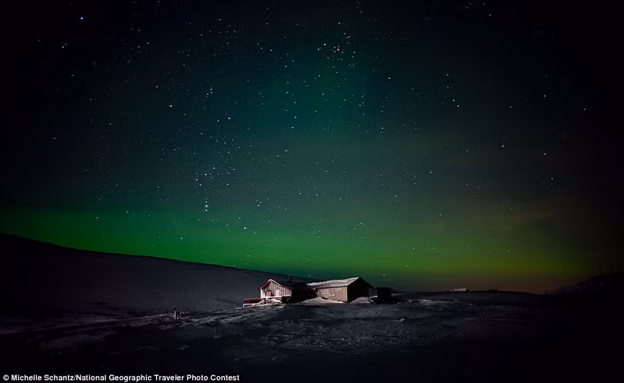 Michelle Schantz: A lonely cabin is illuminated under the Northern Lights in Finmmark, Norway Read more: http://www.dailymail.co.uk/news/article-2189479/National-Geographic-reveal-winners-2012-Photo-Contest.html#ixzz23mDVs4PA