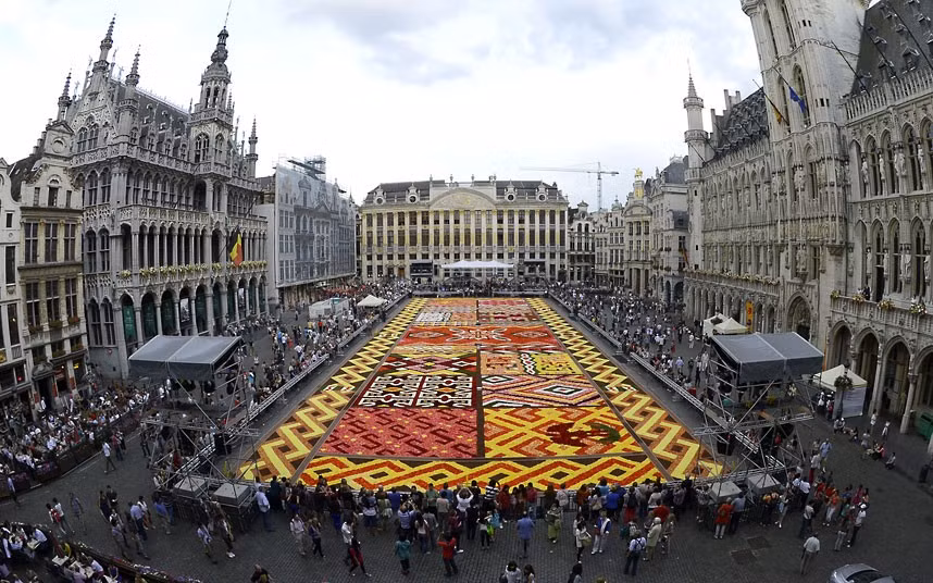 A floral carpet, made up with about 600,000 flowers, is laid on the Grand Place in Brussels, Belgium