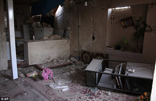 A house in the city of Varzaqan is pictured after being hit by the quake; at least 60 villages sustained damage ranging from 50 to 80 percent, while 4 other villages had been totally leveled to the ground Read more: http://www.dailymail.co.uk/news/article-2187105/Earthquake-hits-Iran-killing-87-injuring-600-villages-totally-demolished.html#ixzz23INC40A2