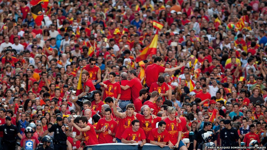 Spain’s players celebrate with their fans and the Uefa Euro 2012 trophy on a double-decker bus parade in Madrid. Spain beat Italy 4-0 in the final in Kiev, Ukraine.