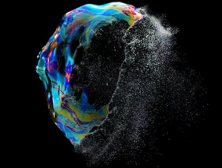 Swiss photographer Fabian Oefner captures the short-lived beauty of bubbles at the point of bursting. He says: I did a couple of hundred shots to finally capture the moment, when the soap film starts to disrupt. But eventually one gets a sense of when the bubble bursts and finally I got that perfect shot, where half of the bubble is already gone and the other half is still glowing in its magnificent colours.