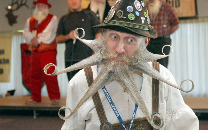 Aarne Bielefeldt from California poses for the judges at the North American Beard and Mustache Championships at the Bremerton Elks Lodge. He scored a perfect score and won first place in the freestyle category.