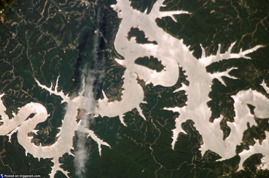 Beaver Lake in Arkansas USA Beaver Lake, a man-made reservoir, completed in 1966 and nestled high in the Ozark Mountains, is located in northwest Arkansas, the birthplace of the White River. Even if man-made lakes sometimes are destructive to wildlife, it is still pretty impressive how mankind can shape our planet. 