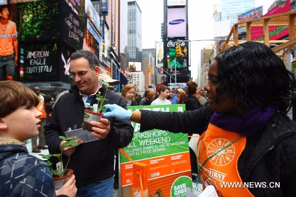 People visit at a fair promoting green lifestyle on the Times Square in New York, the United States