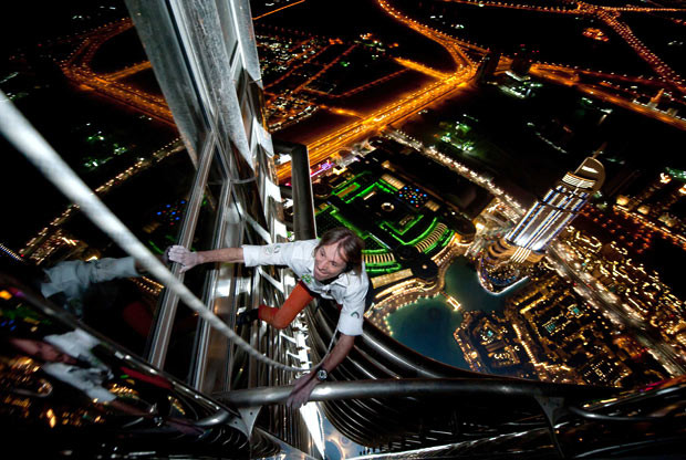 French Spiderman Alain Robert completes his latest climbing feat - scaling the tallest building in the world. The 47-year-old took six hours to ascend the 828m (2,717ft) tall Burj Khalifa in Dubai. Wind delayed his ascent for several hours but didn’t stop him from successfully reaching the top of the tapered spire above the 160th floor of the building. Alain is famous for climbing buildings around the world, which he normally does just using his bare hands and climbing shoes. However, for this attempt he had to use a rope and harness in order to comply with safety regulations.