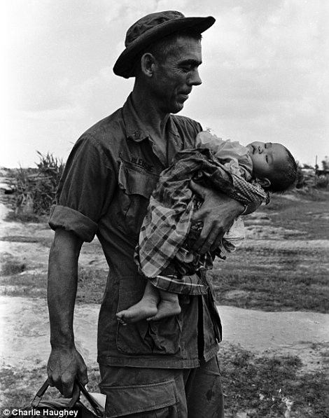 Iconic: On the left, Staff Sergeant Edgar D. Bledsoe of Olive Branch, Illinois cradles a critically ill child; on the right, a soldier prepares to fire a mortar captured from the Vietcong Read more: http://www.dailymail.co.uk/news/article-2303845/Never-seen-images-Vietnam-War-eyes-soldier-hid-photographs-decades.html#ixzz2PYZgxIDU Follow us: @MailOnline on Twitter | DailyMail on Facebook
