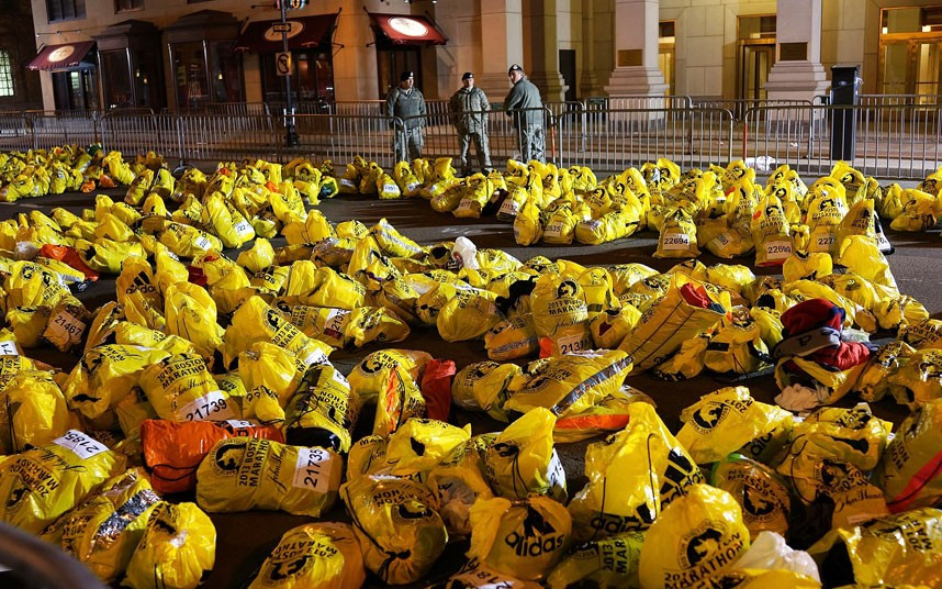Unclaimed finish line bags are viewed near the scene of the twin bombing at the Boston Marathon