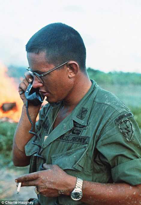 Lost photographs: Charlie Haughey documented life in the US army as it waged war in the south-east Asia country. His pictures, aimed at raising morale, remained hidden in boxes until 2002. A machine gunner is seen smoking as he walks through the jungle weighed down with ammo (left) while an officer is given orders on a field telephone (right) Read more: http://www.dailymail.co.uk/news/article-2303845/Never-seen-images-Vietnam-War-eyes-soldier-hid-photographs-decades.html#ixzz2PYXJjzKa Follow us: @MailOnline on Twitter | DailyMail on Facebook