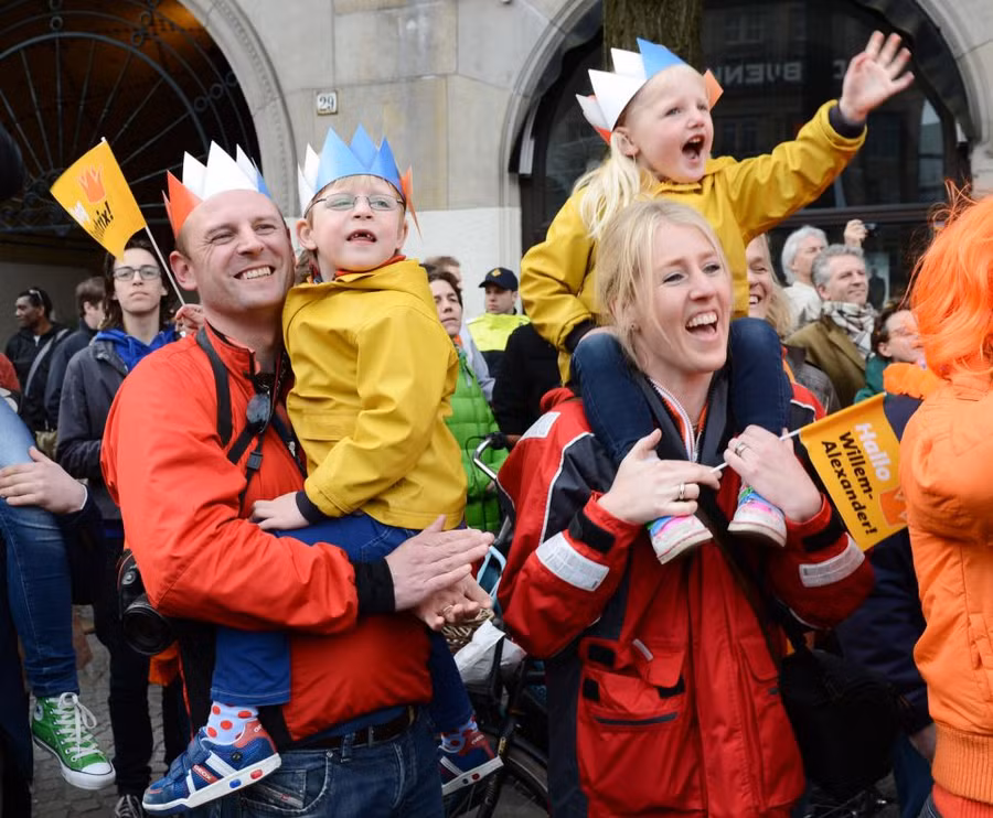 Jubilant: Supporters cheer as the royal family take their place on the balcony in front of a sea of orange Read more: http://www.dailymail.co.uk/news/article-2316988/Queen-Beatrix-Netherlands-abdicates-Thousands-Dutch-turn-monarch-sign-away-throne.html#ixzz2Rwi5s3xf Follow us: @MailOnline on Twitter | DailyMail on Facebook