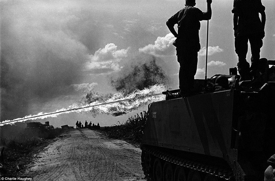 Blaze: A specially adapted personnel carrier known as a ’flame track’ shoots out fire to avoid ambushes at the side of the road. The trucks, or M132s were first used by the US military in 1962 but were taken out of deployment in 1978 Read more: http://www.dailymail.co.uk/news/article-2303845/Never-seen-images-Vietnam-War-eyes-soldier-hid-photographs-decades.html#ixzz2PYYzALWn Follow us: @MailOnline on Twitter | DailyMail on Facebook