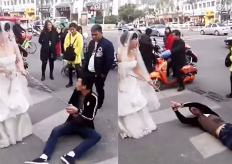 Co gai mac vay cuoi, xich tay ban trai keo di lam le - Anh 1