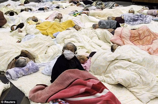 People who are evacuated from a nursing home which is located in evacuation area around the plant rest at a temporary shelter in Koriyama today Read more: http://www.dailymail.co.uk/news/article-1365781/Japan-earthquake-tsunami-Fears-second-explosion-nuclear-power-plant-exclusion-zone-facility-widened.html#ixzz1GUm49usl
