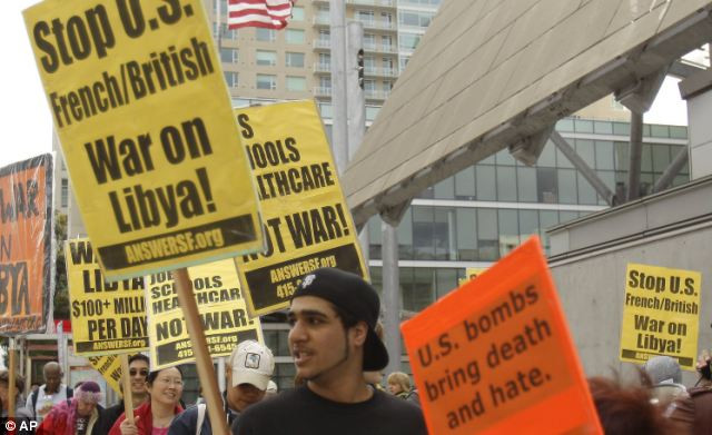 President Obama is facing opposition to America’s involvement in Libya Read more: http://www.dailymail.co.uk/news/article-1369452/Libya-Fighter-jets-shoot-Gaddafi-warplane-regimes-troops-parade-charred-bodies.html#ixzz1HWnsBhrh