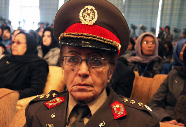 Các hoạt động kỷ niệm ngày Quốc tế Phụ nữ trên thế giới ảnh 5 An Afghan senior policewoman listens to a speech by President Hamid Karzai during a seminar on International Women’s Day in Kabul. Afghanistan’s independent human rights watchdogs and civil society organisations say that gender violence has reached an alarming level in the country and efforts must be redoubled to tackle it. Forced marriages and a lack of education contribute to a recent spate of suicide attempts among women in Afghanistan