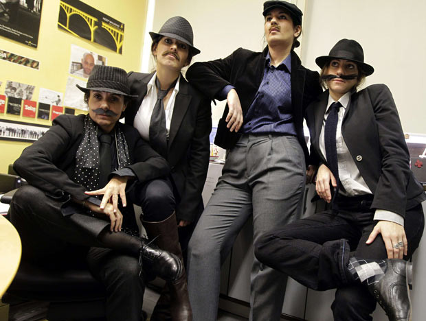 Các hoạt động kỷ niệm ngày Quốc tế Phụ nữ trên thế giới ảnh 4 Lebanese women working at an advertising company in Beirut dress like men and pose for pictures to make a statement about gender inequalities