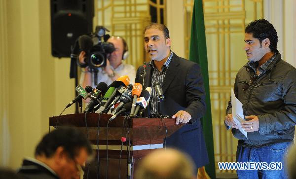 Mousa Ibrahim (C), the government spokesman, reads letters from the Libyan leader Gaddafi in Tripoli, Libya, March 19, 2011