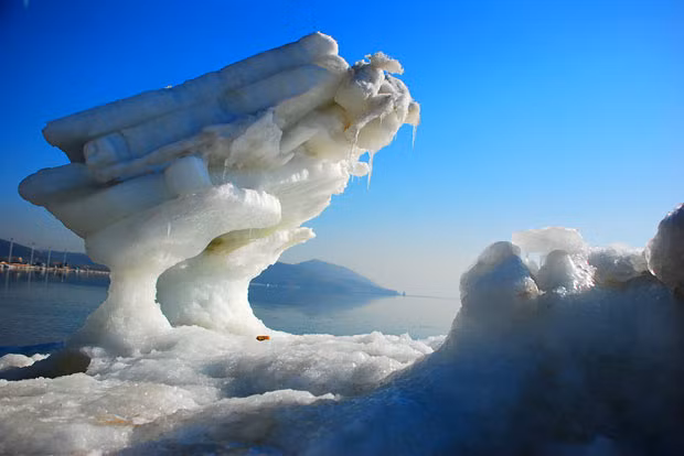 A beautiful ice formation is seen at Bohai Bay in in northeast China’s Liaoning Province. Ice blocks are scattered along the bay and have been sculpted by the elements into various fantastical shapes. A local fisherman who has been fishing in the area for more than 20 years, said it’s the first time he seen such large clusters of ice blocks. The local Sea Office said this past winter was the coldest in years, and many ice blocks were transported by the waves to the sea bank. Rising temperature have melted the blocks into strange shapes.