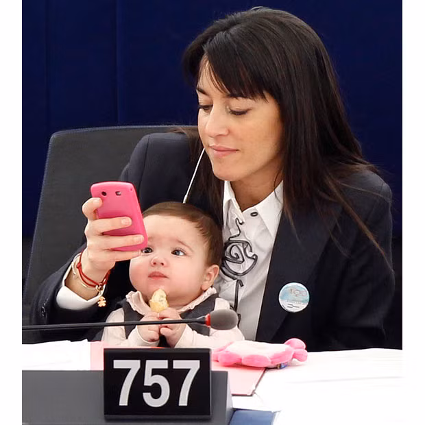 Member of the European Parliament Licia Ronzulli of Italy holds her baby during a voting session at the European Parliament in Strasbourg to mark the International Women’s Day