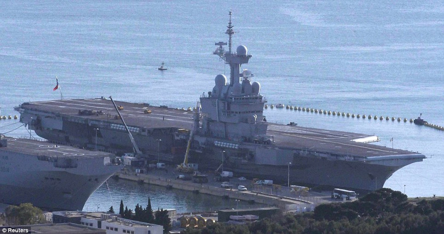The French aircraft carrier Charles De Gaulle, currently deployed at a naval base in Toulon, could soon be called into action Read more: http://www.dailymail.co.uk/news/article-1367764/David-Cameron-tells-Gaddafi-time-UK-jets-prepare-lead-UN-force.html#ixzz1H3s9lq2M