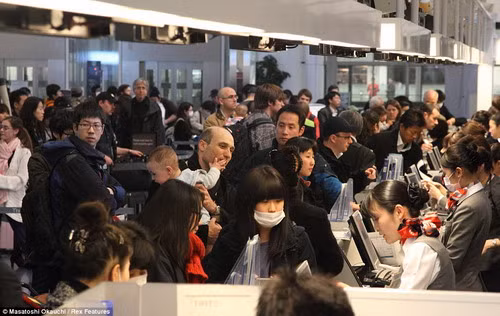 Passengers crowd Mar Haneda International Airport outside Tokyo as foreigners scramble to flee the country amid radiation fears Read more: http://www.dailymail.co.uk/news/article-1366670/Japan-earthquake-tsunami-French-claim-scale-nuclear-disaster-hidden.html#ixzz1GsbZFP00