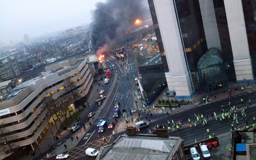 Smoke pours from the burning debris of a helicopter which crashed in the Vauxhall area. If you have eyewitness photos of the helicopter crash in Vauxhall, please email them to mypic@telegraph.co.uk