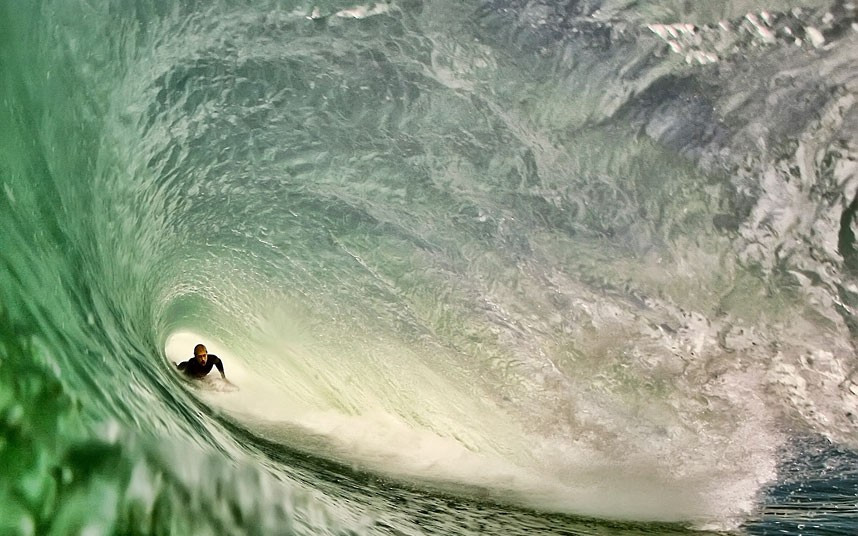 A surfer is pictured in the barrel of a wave. Photographer Stephane Salerno spends up to seven hours in the sea at a time to get close-ups of surfers in action.