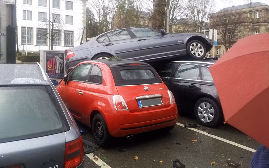 Parking is tight in any city during the New Year sales but this driver from Kassel, Germany, looks like he’s taken it to a whole new level. Kurt Schneider lost control of his BMW and ended up on top of these parked cars after he was sent sailing through the air during a high speed shunt. He wasn’t hurt apart from a few cuts and bruises but we can’t say the same for the cars, said a police spokesman.Accident investigators say the insurance bill could top £150,000.